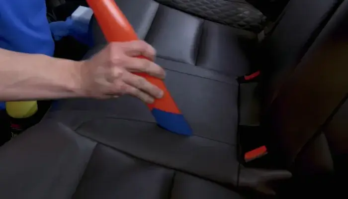 Vacuum the seats to remove loose dirt