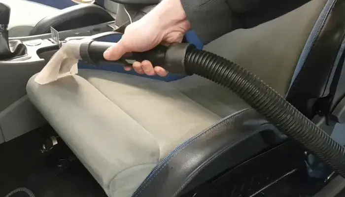 Vacuuming the Seats to Remove Loose Dirt and Debris