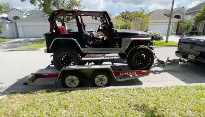 Jeep Towing On A Trailer